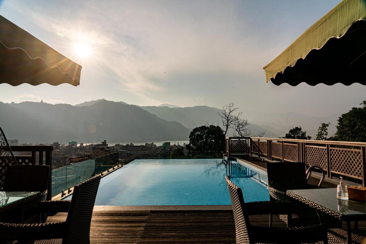 Bar Peepal Resort Похара Екстериор снимка The swimming pool at the hotel