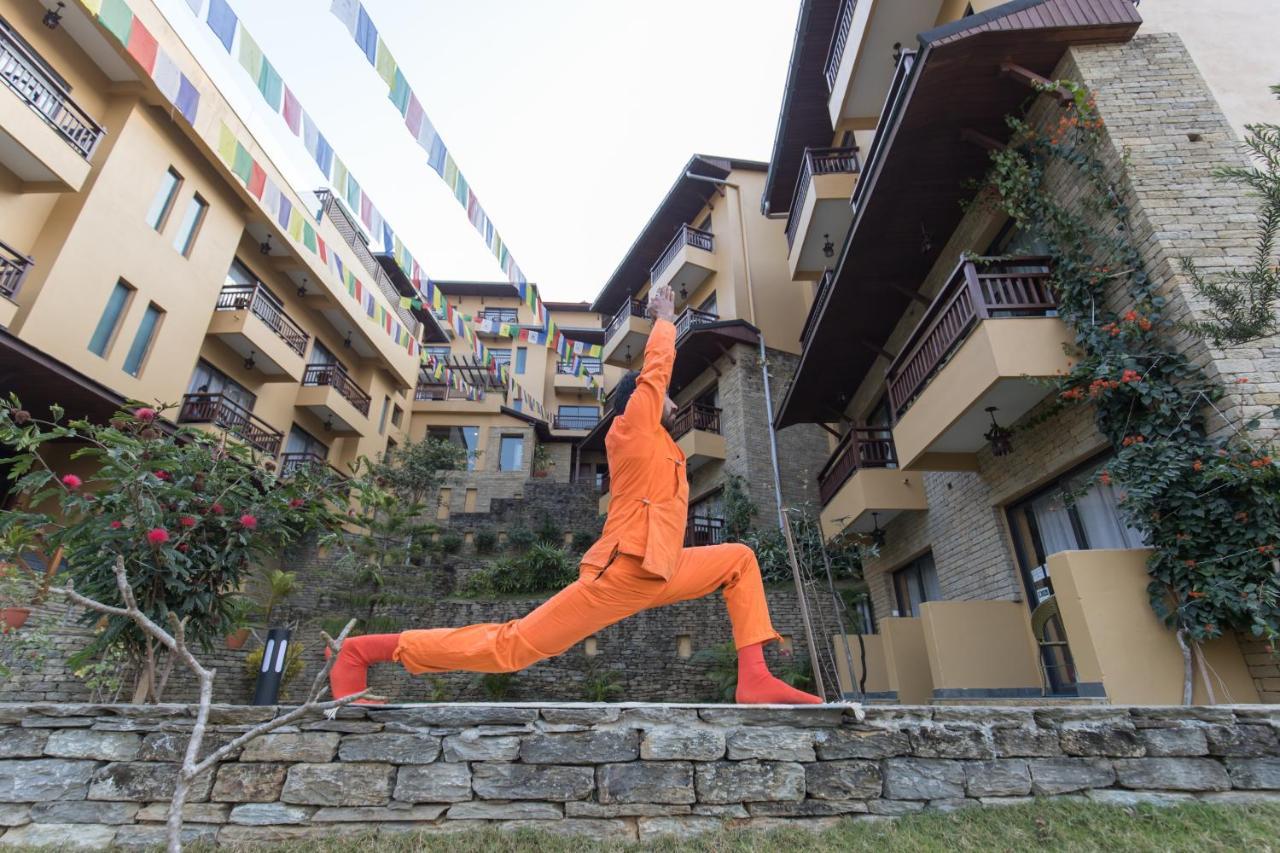 Bar Peepal Resort Похара Екстериор снимка A student of the Drepung Loseling Nunnery, practicing yoga.