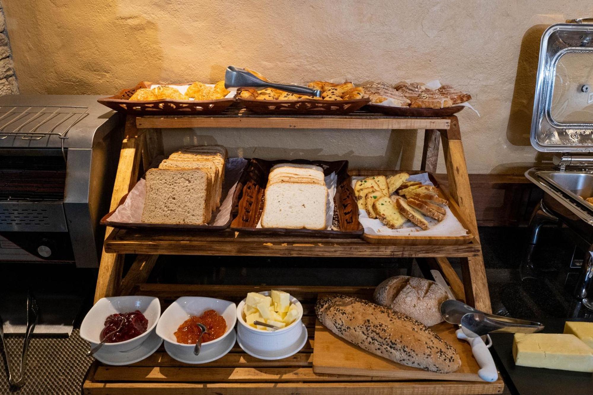 Bar Peepal Resort Похара Екстериор снимка A selection of cheeses at a buffet