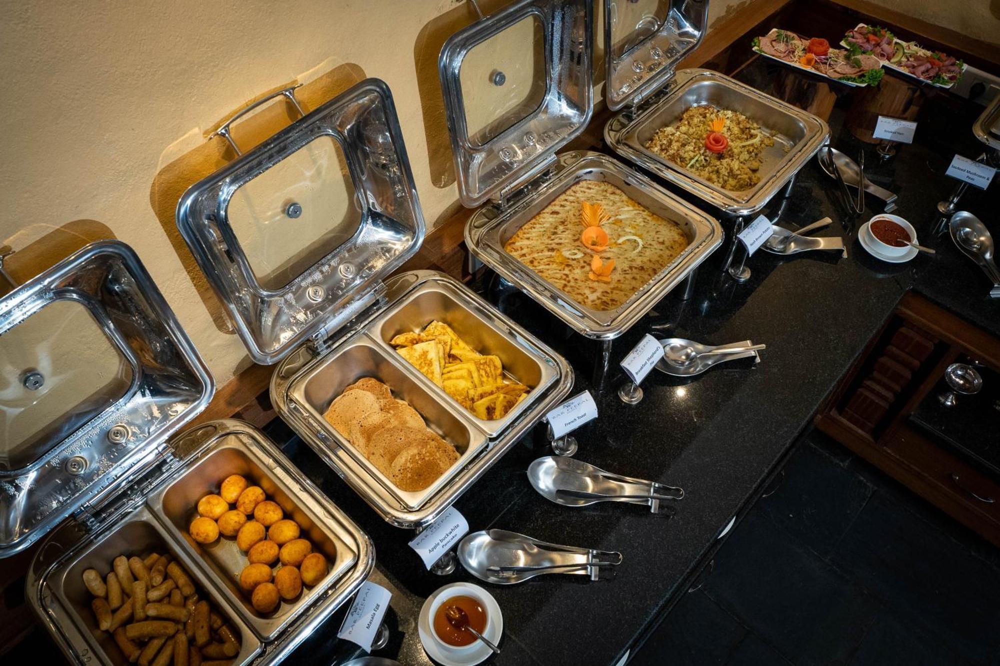 Bar Peepal Resort Похара Екстериор снимка A selection of chafing dishes