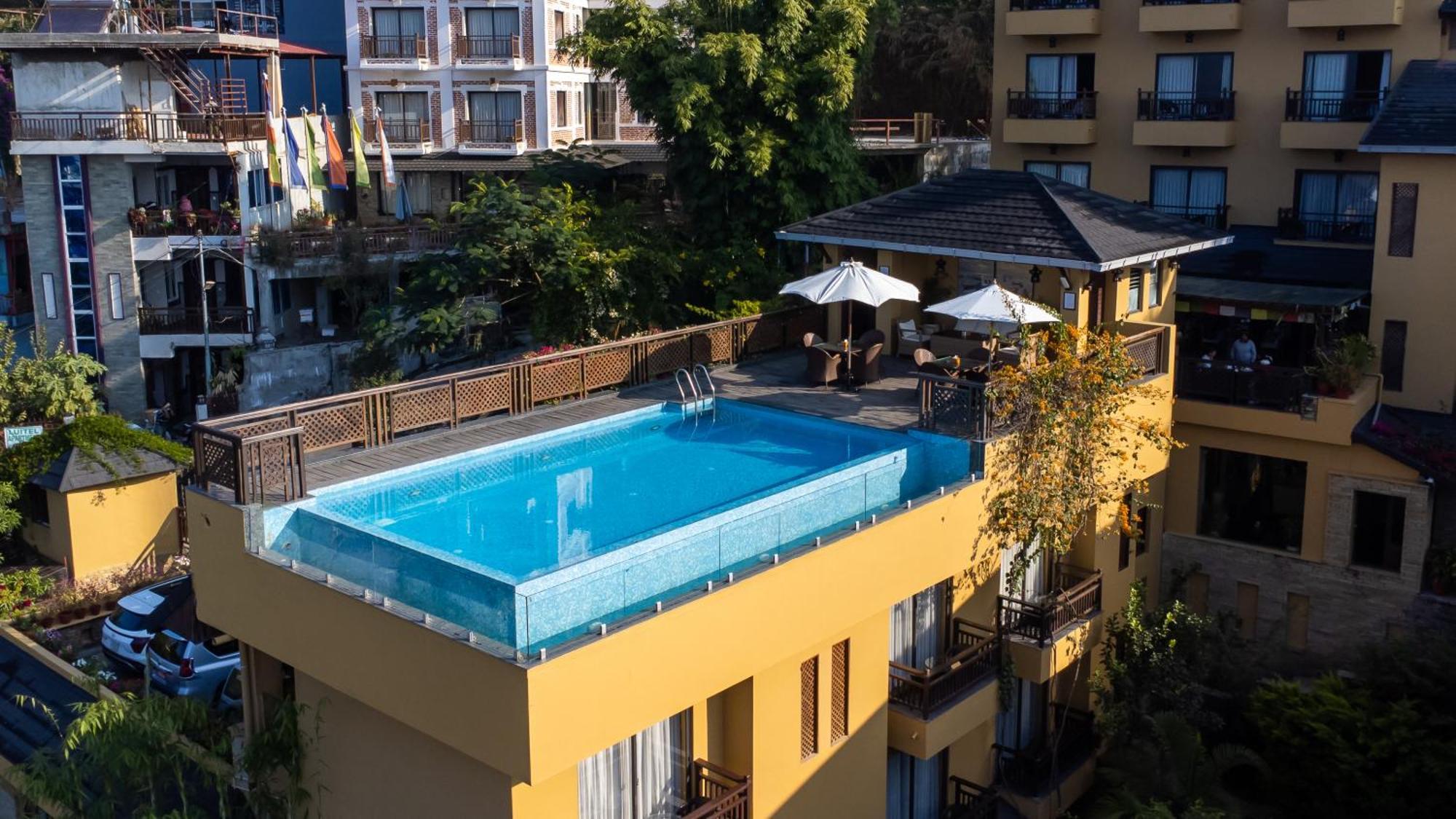 Bar Peepal Resort Похара Екстериор снимка Rooftop pool at the Hotel