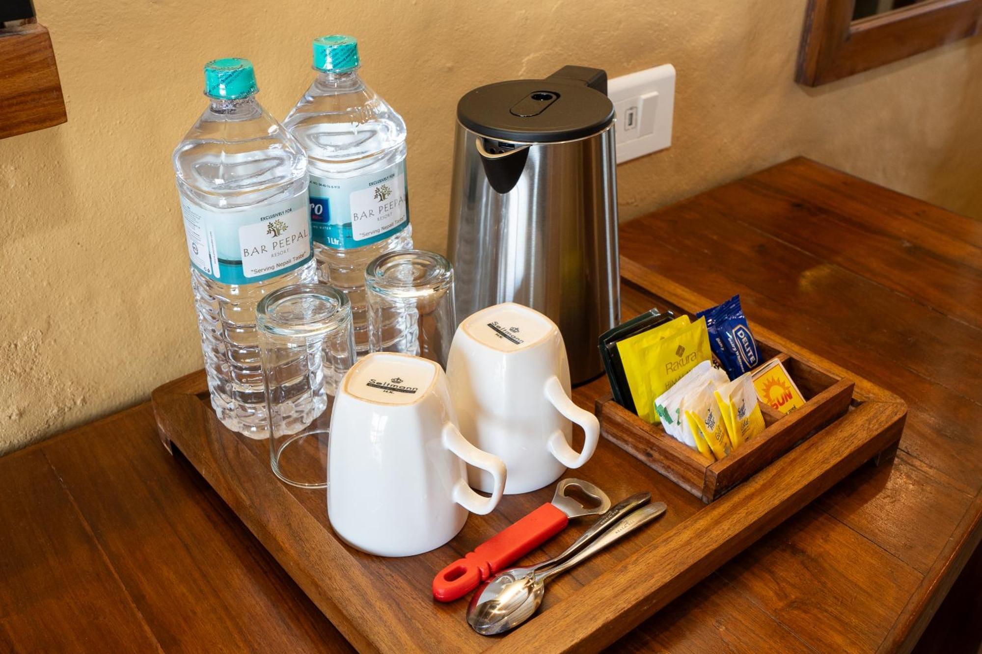 Bar Peepal Resort Похара Екстериор снимка A tea tray